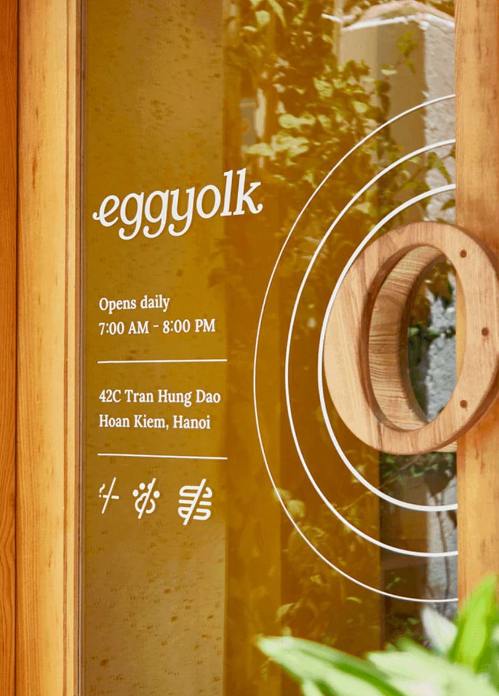 The glass door at 42C Tran Hung Dao with Eggyolk lettering